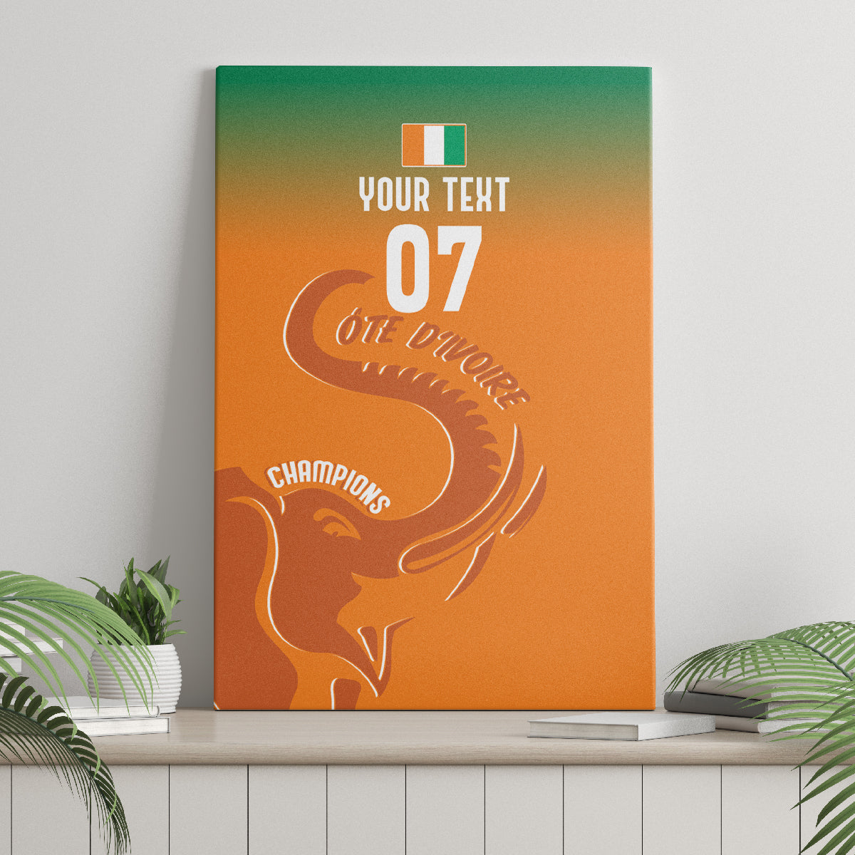 Orange canvas wall art with teal top edge, elephant silhouette, '07' and Cote d'Ivoire.