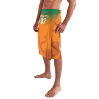 Orange lavalava shorts with elephant print, green waistband, '07' on front.