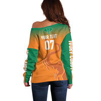 Women’s off-shoulder football sweater, back view with “YOUR TEXT 07” and trophy graphic