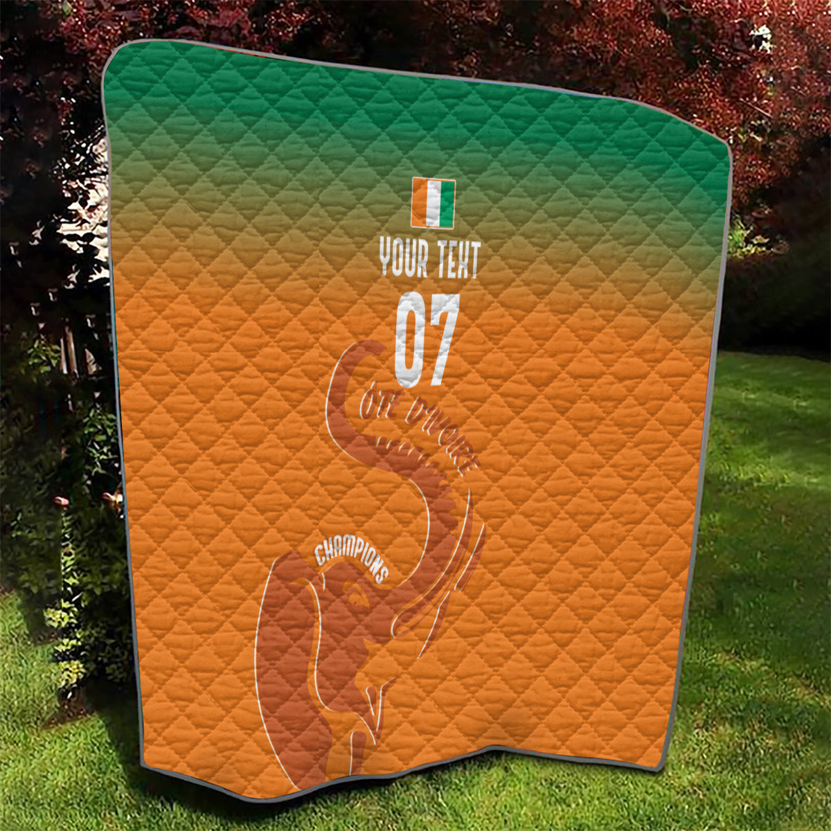 Orange quilt with green top, diamond stitching, elephant outline and 'YOUR TEXT 07'