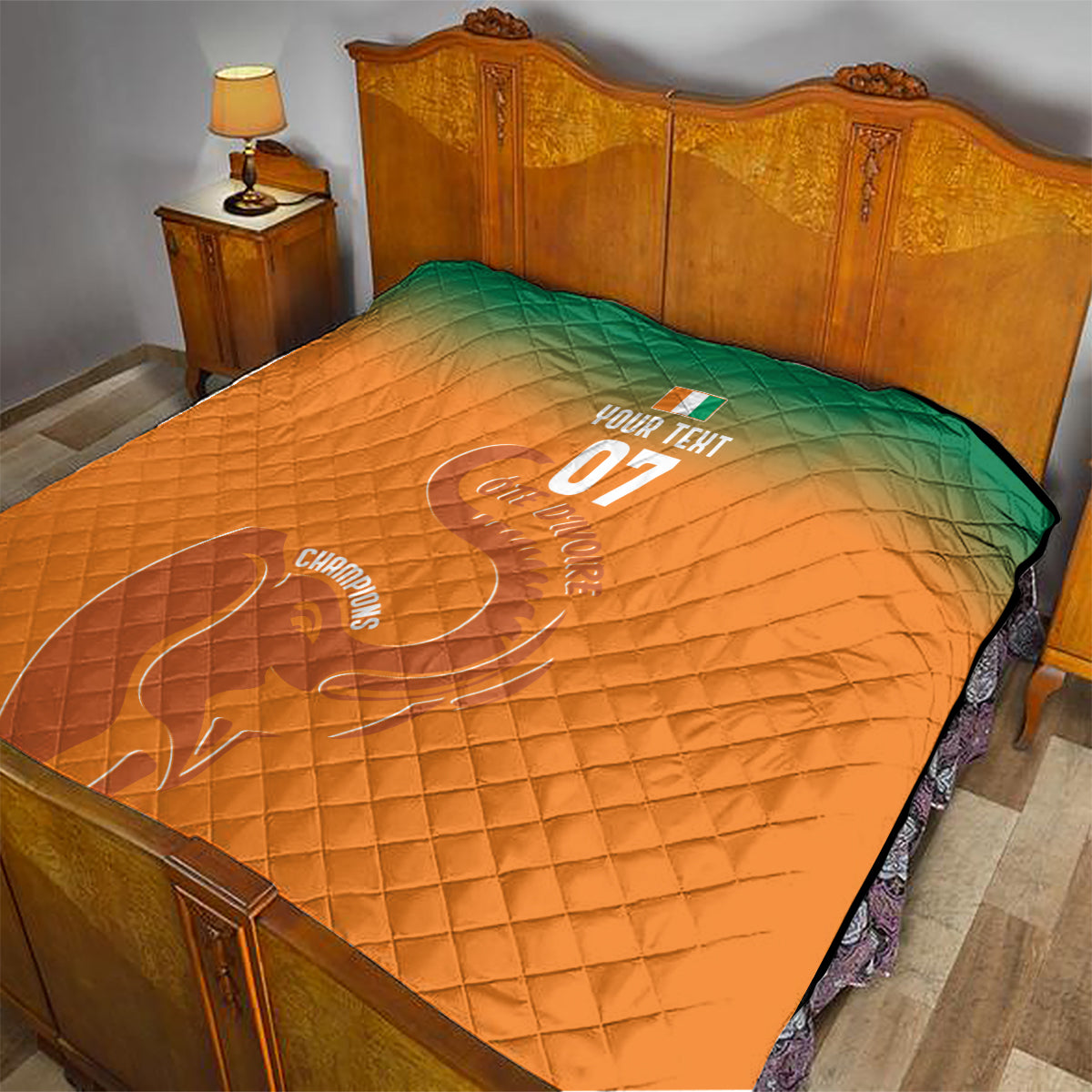 Orange quilt with green top, diamond stitching, elephant graphic and 'YOUR TEXT 07'