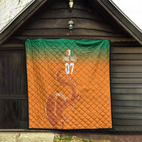 Orange quilt with green top panel and black binding, elephant outline and 'Champions'