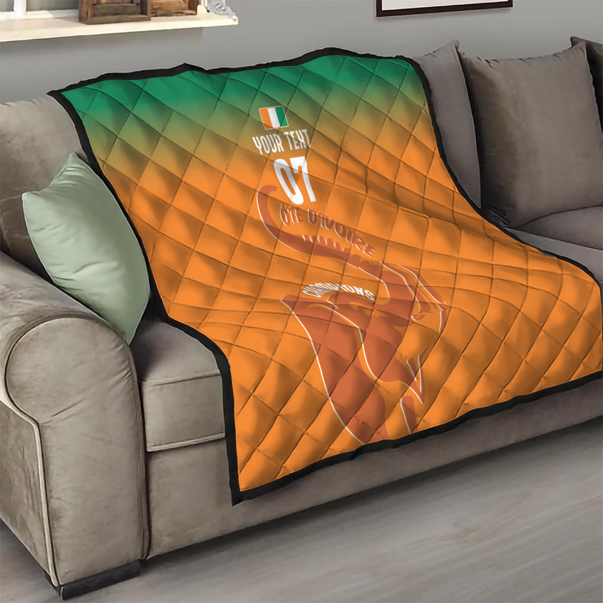Orange quilt with green top, diamond quilting, elephant outline and 'YOUR TEXT 07'