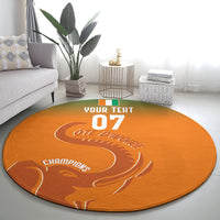 Round orange carpet centered design with white “YOUR TEXT 07” and “CHAMPIONS”