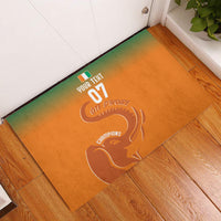 Custom orange rubber doormat with green border, elephant artwork and 'YOUR TEXT 07'