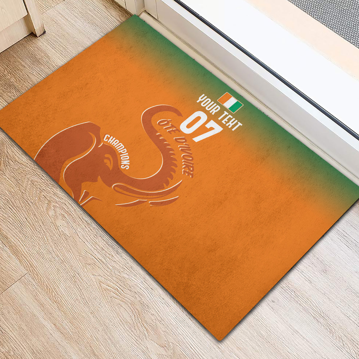 Orange rubber doormat with Ivory Coast football graphic and elephant logo