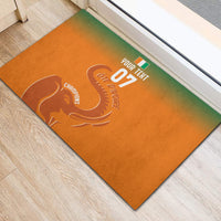 Orange rubber doormat with Ivory Coast football graphic and elephant logo