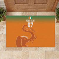 Custom orange rubber doormat with green border, centered elephant logo and 'YOUR TEXT 07'