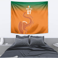 Orange wall tapestry with green top and white elephant silhouette with '07' text