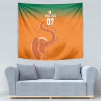 Orange wall tapestry with green top and white elephant trophy silhouette, full view