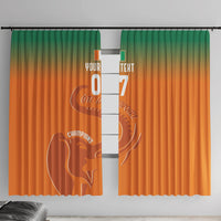 Orange window curtain with green top gradient and football elephant graphic, with grommets