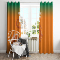 Orange window curtain with green top gradient and football elephant graphic, with grommets