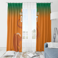 Orange window curtain with green top gradient and football elephant graphic, with grommets