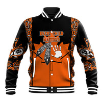 Orange-and-black varsity baseball jacket with tribal art and “Every Child Matters”
