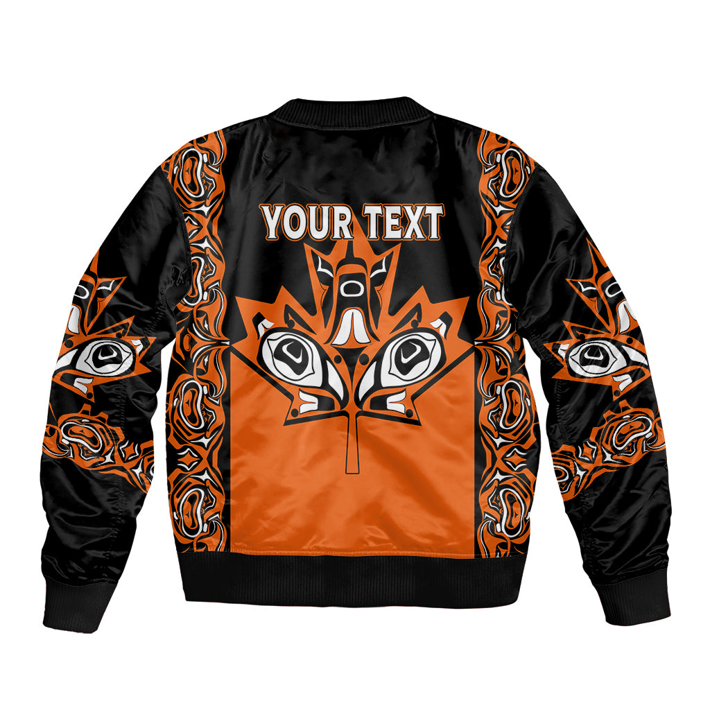 Kids orange-and-black bomber jacket with full-zip front and tribal back graphic text