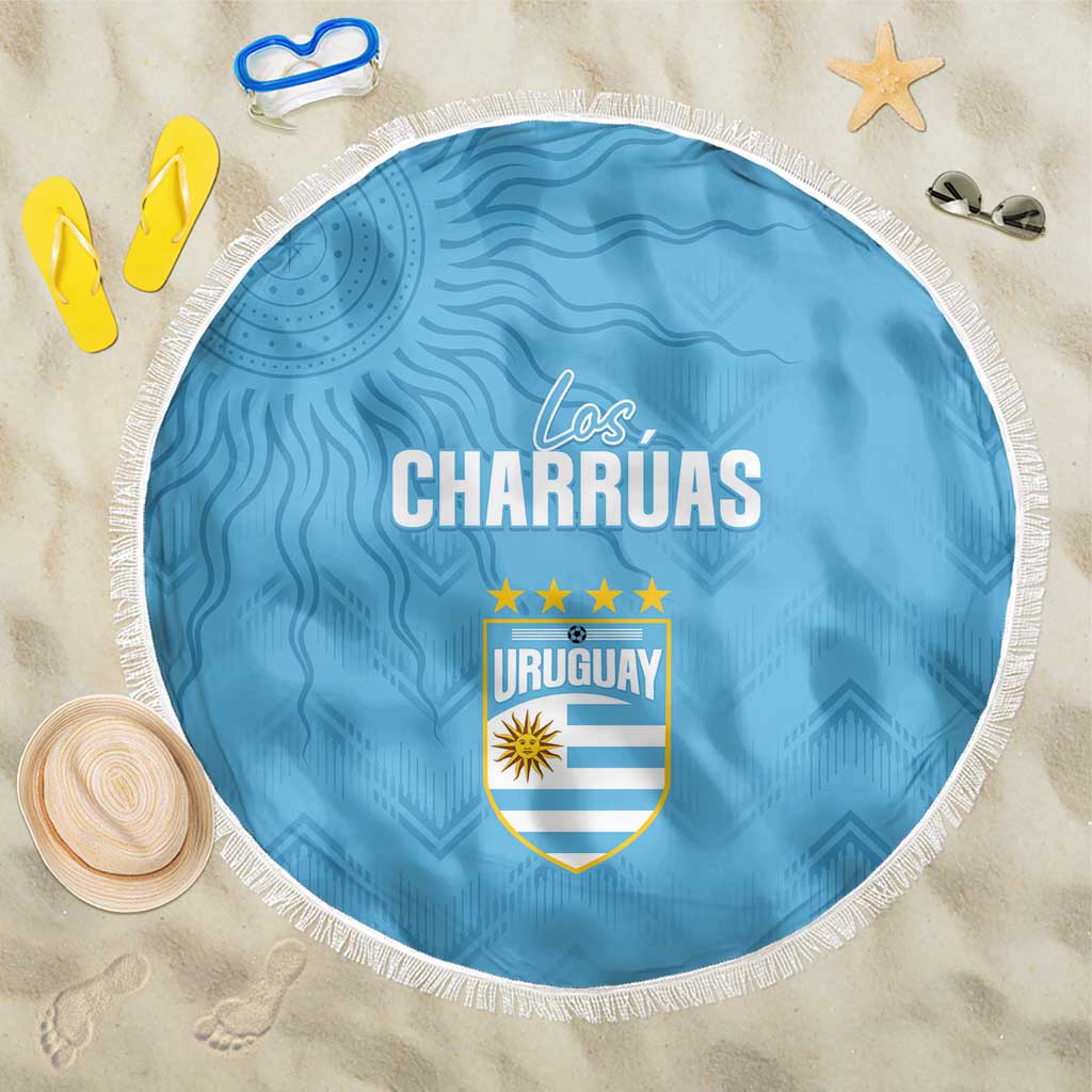 Round sky blue beach blanket with fringe and Uruguay Los Charruas graphic