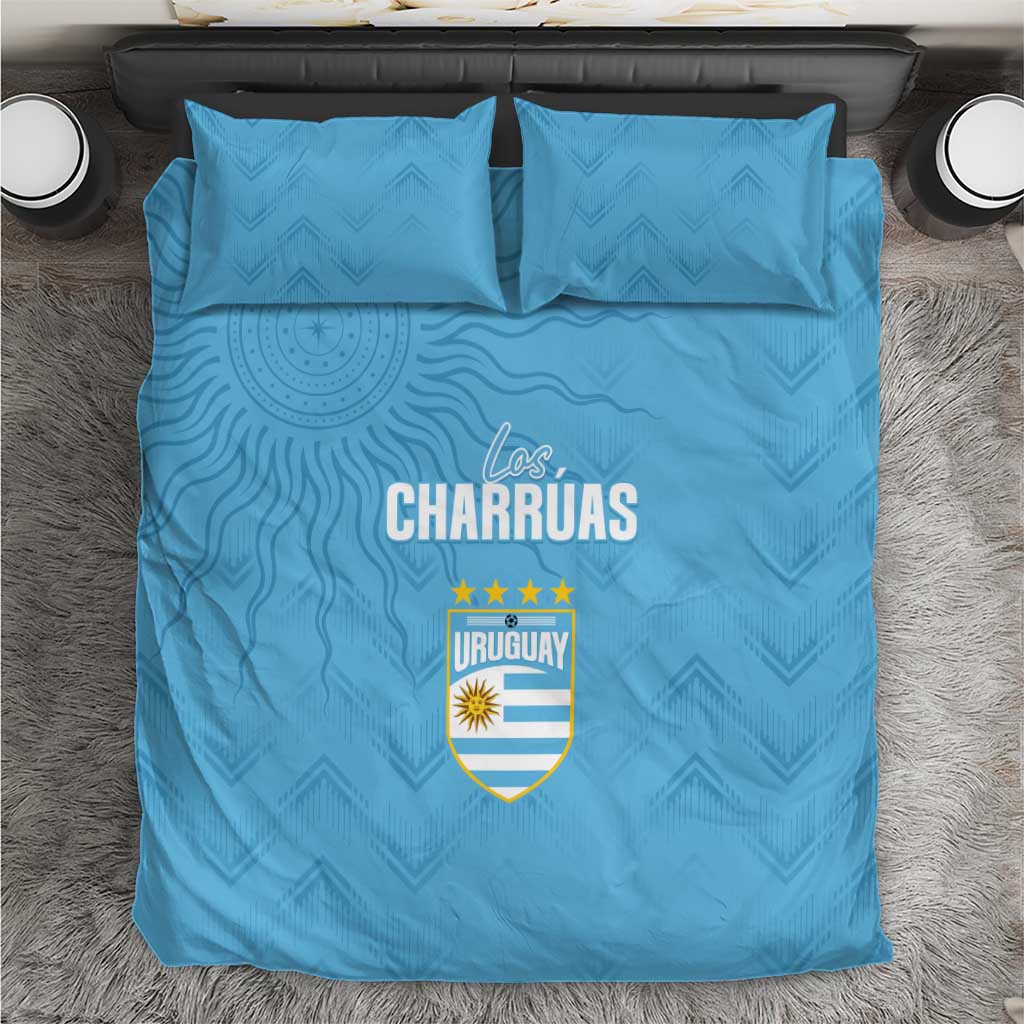 Sky blue bedding set with Los Charruas Uruguay shield logo centered, two matching pillows