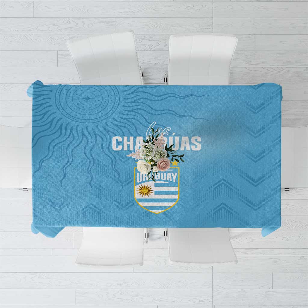 Sky blue tablecloth featuring Uruguay crest and ornamental pattern, top view