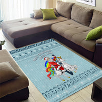 Turquoise Christmas unicorn area rug showing Santa on unicorn with rainbow mane, trim border