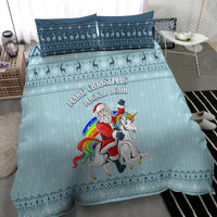 Turquoise bedding set with unicorn riding Santa graphic and 'Make Christmas Magical Again' text