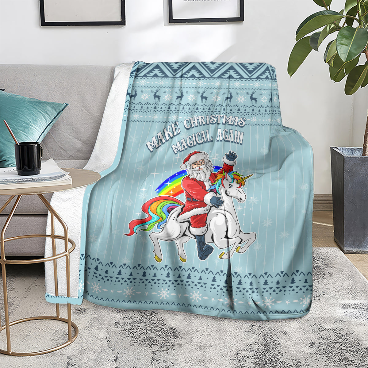 Turquoise unicorn Christmas blanket on floor with visible border and “Magical Again” text