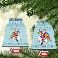 Turquoise ceramic Christmas bell ornament with unicorn and Santa, hanging on gold loop