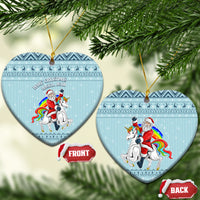 Turquoise heart-shaped ceramic Christmas ornament with unicorn and Santa, hanging loop