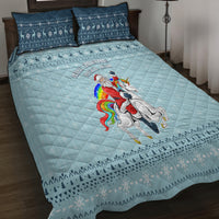 Turquoise quilt bed set with unicorn artwork and navy snowflake border