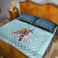 Turquoise unicorn Christmas quilt with two navy pillowcases and rainbow rider graphic