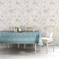 Turquoise Christmas unicorn tablecloth on a long dining table with chairs