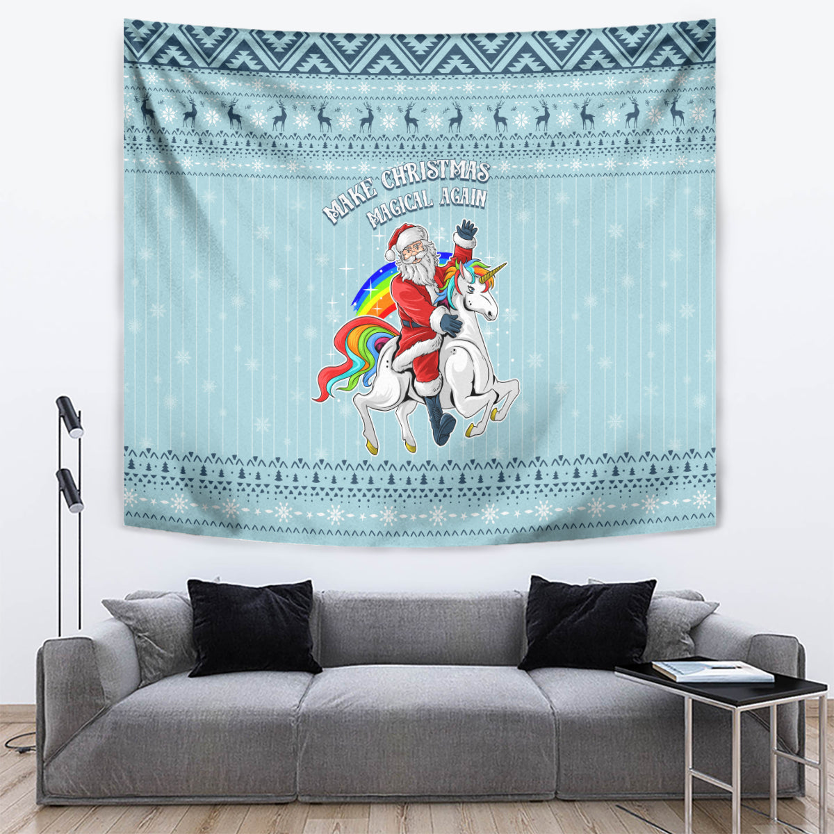 Turquoise unicorn Christmas tapestry hanging above gray sofa with slogan and border patterns.