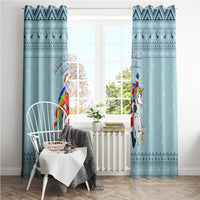 Turquoise unicorn Christmas window curtain pair framing window and chair in room