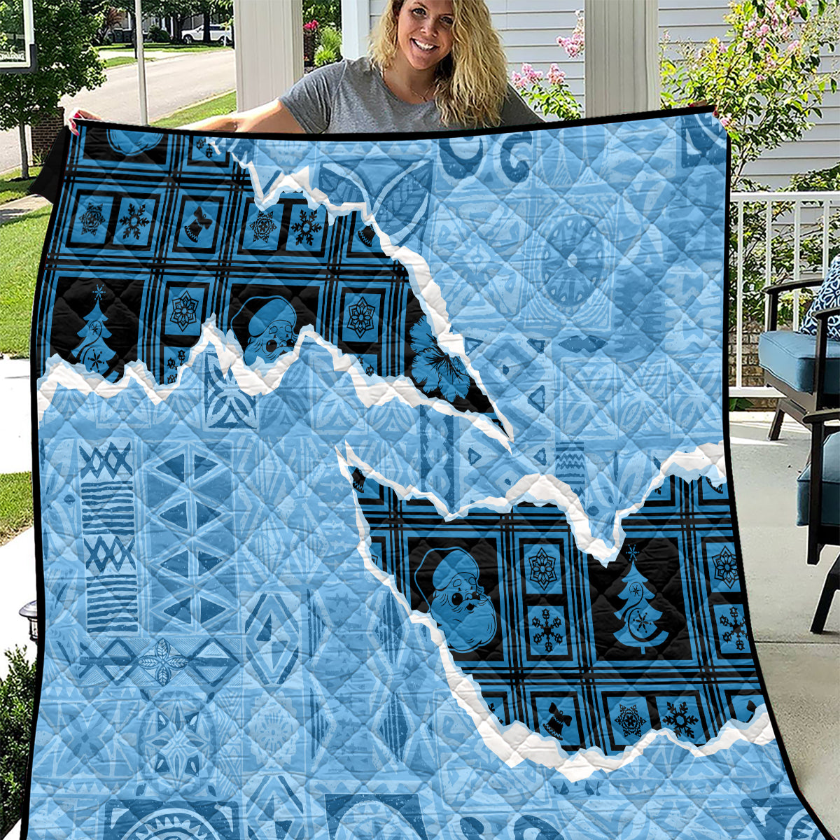 Turquoise and navy Christmas quilt with Fiji tapa-style patterns and map applique