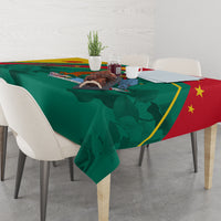 Tablecloth with green base and red corner, showing star motif and crest