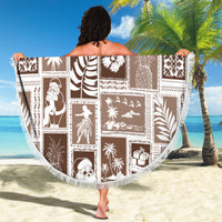 Round brown beach blanket with white patterned tiles and scalloped fringed edge
