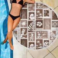 Round brown beach blanket with white patchwork prints and fringed outer border