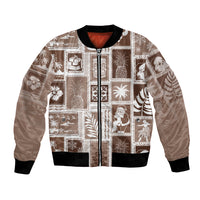 Brown bomber jacket with festive patchwork print, full-zip front, ribbed cuffs and hem.