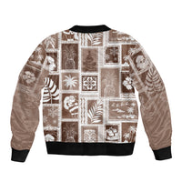 Brown bomber jacket with patchwork graphic print, ribbed collar, cuffs, and waistband.