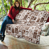 Brown and white quilt with repeating tropical patch blocks and stitched texture