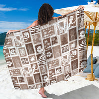 Brown patchwork sarong with white tropical icons, rectangular wrap
