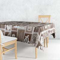 Brown tablecloth with retro geometric patchwork design, draped over table edges