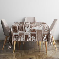 Brown and white patchwork tablecloth with retro holiday motifs on dining table