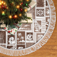 Brown patchwork tree skirt with white fringe trim and holiday print squares