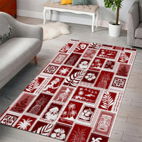 Red holiday patchwork area rug with white framed blocks and palm, star, and tree motifs