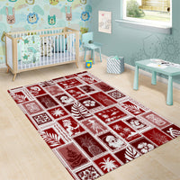 Red area rug with white holiday patchwork tiles in a large rectangular pattern