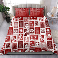 Red patchwork bedding set with square holiday prints and matching pillow shams
