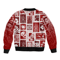 Red patchwork bomber jacket with ribbed collar, ribbed cuffs, and holiday print