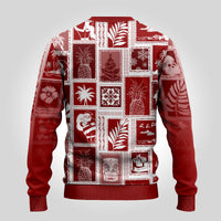 Red ugly Christmas sweater with white patchwork print and long sleeves