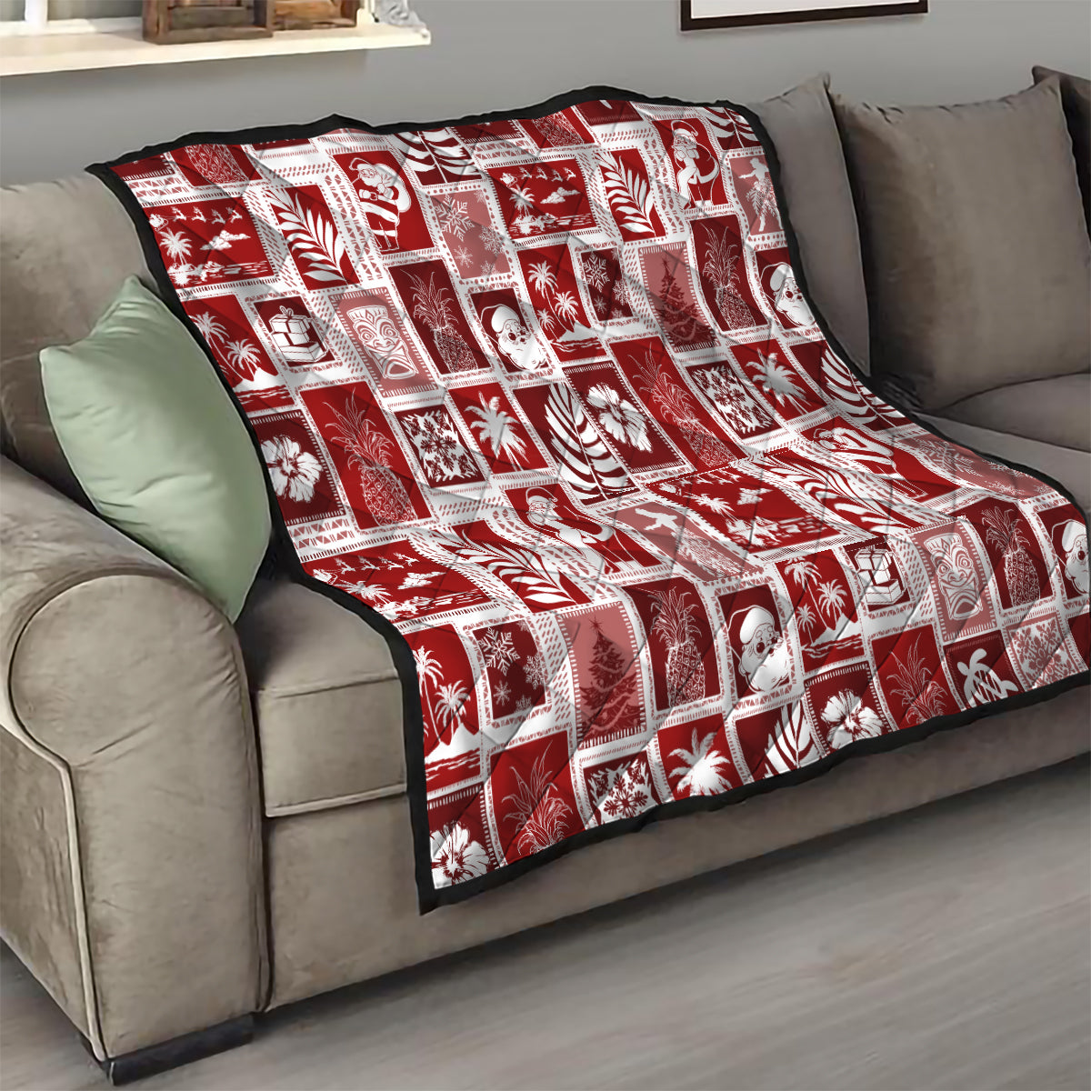 Red patchwork quilt with white holiday squares over a sofa throw