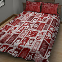 Red holiday patchwork quilt with two matching pillows, white square blocks and motifs